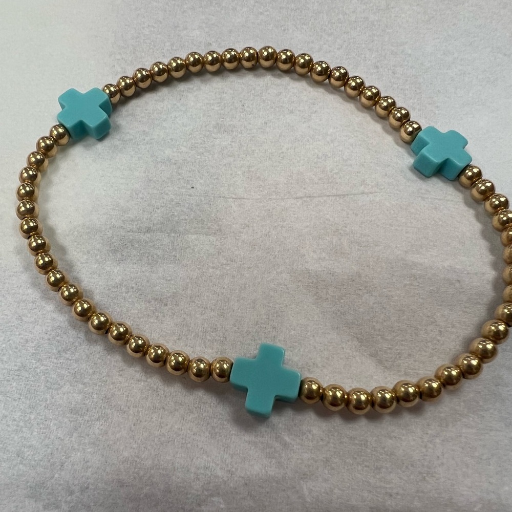 E newton blue cross bracelet